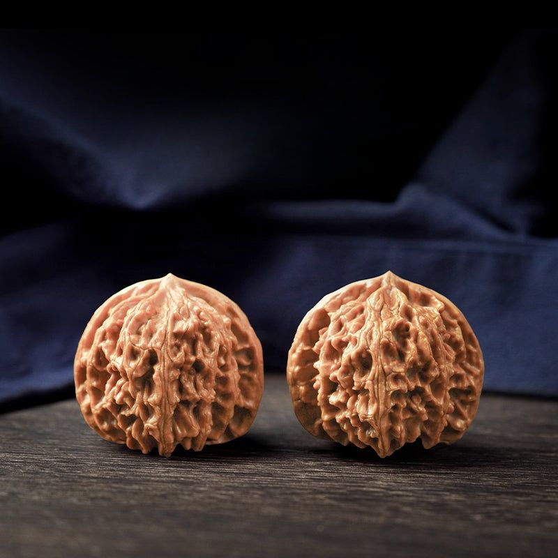 Premium natural colour Chinese Wenwan walnut pair graded by millimetre size